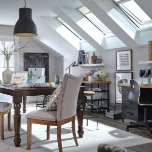 Modern, open living room space with lots of natural light coming in from its many skylights