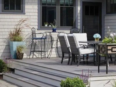 Front view of residential home with white LP vinyl siding